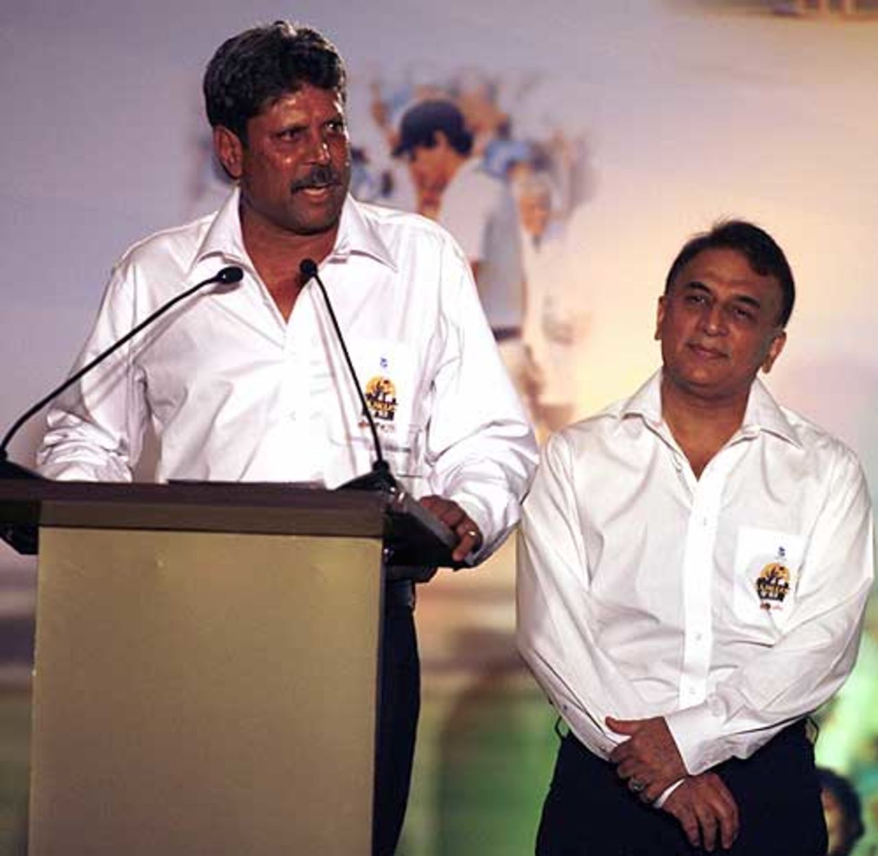 Sunil Gavaskar looks on as Kapil Dev speaks at a World Cup 83 felicitation ceremony hosted by the BCCI, New Delhi, June 22, 2008