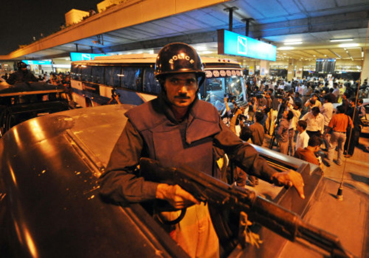 Pakistani police commandos keep watch over India's team bus, Karachi, June 22, 2008