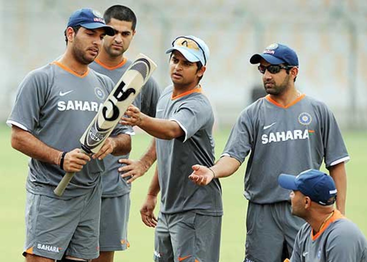 About a bat: Yuvraj Singh's choice of willow draws attention during practice at the National Stadium, Karachi, June 23, 2008