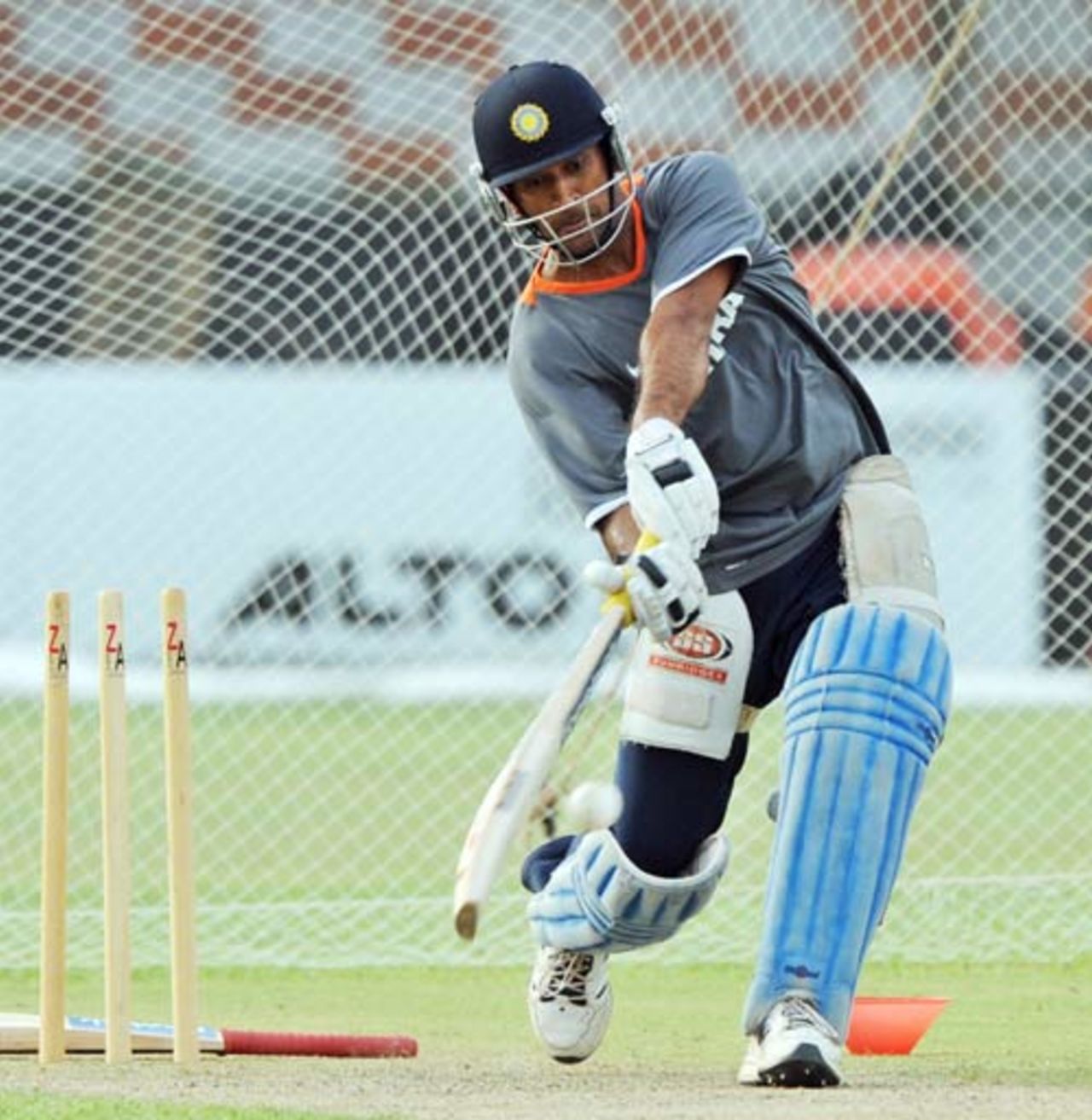 Mahendra Singh Dhoni is set to hammer the ball during a nets session at the National Stadium, Karachi, June 23, 2008