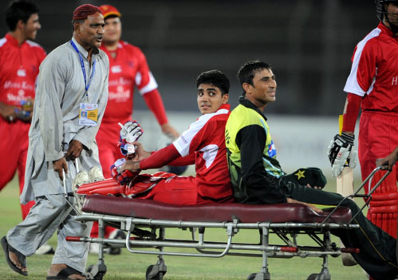 A ride for two:  Zain Abbas and Younis Khan are stretchered off, Pakistan v Hong Kong, Group B, Asia Cup, Karachi, June 24, 2008