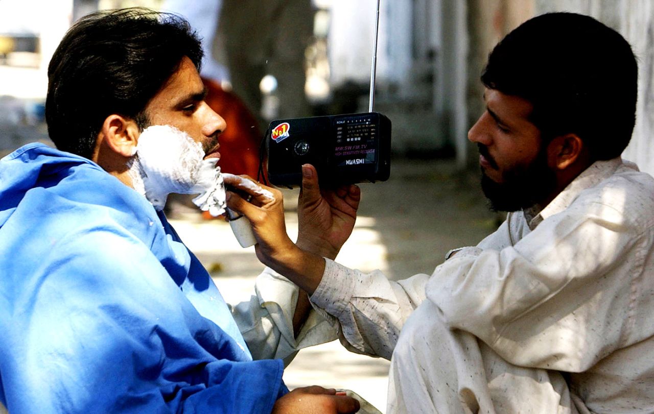 A Pakistani fan listens to the radio commentary of the India-Pakistan ODI, Karachi, March 16, 2004