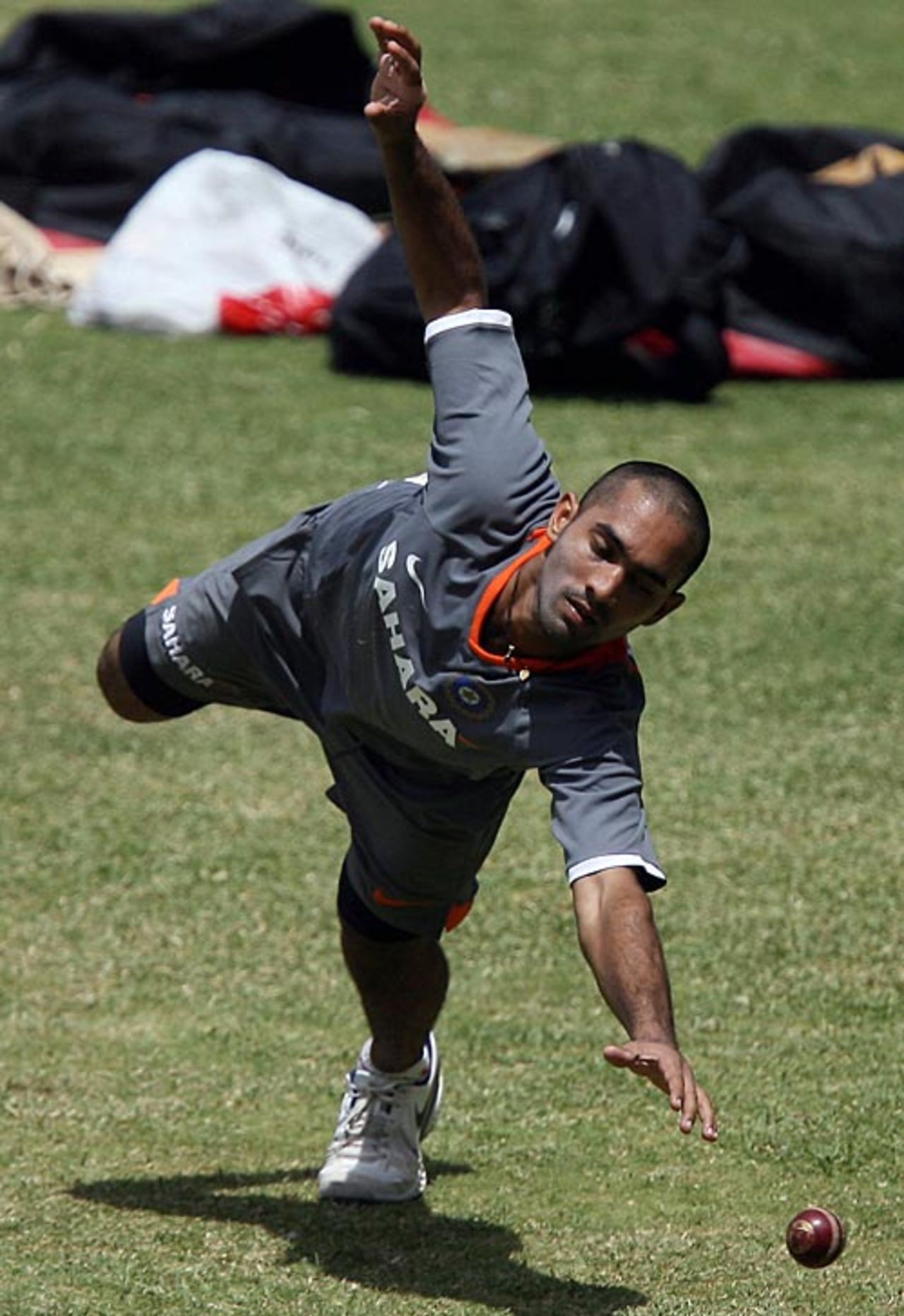 Dinesh Karthik takes catches during a training camp at the Chinnaswamy Stadium, Bangalore, June 25, 2008