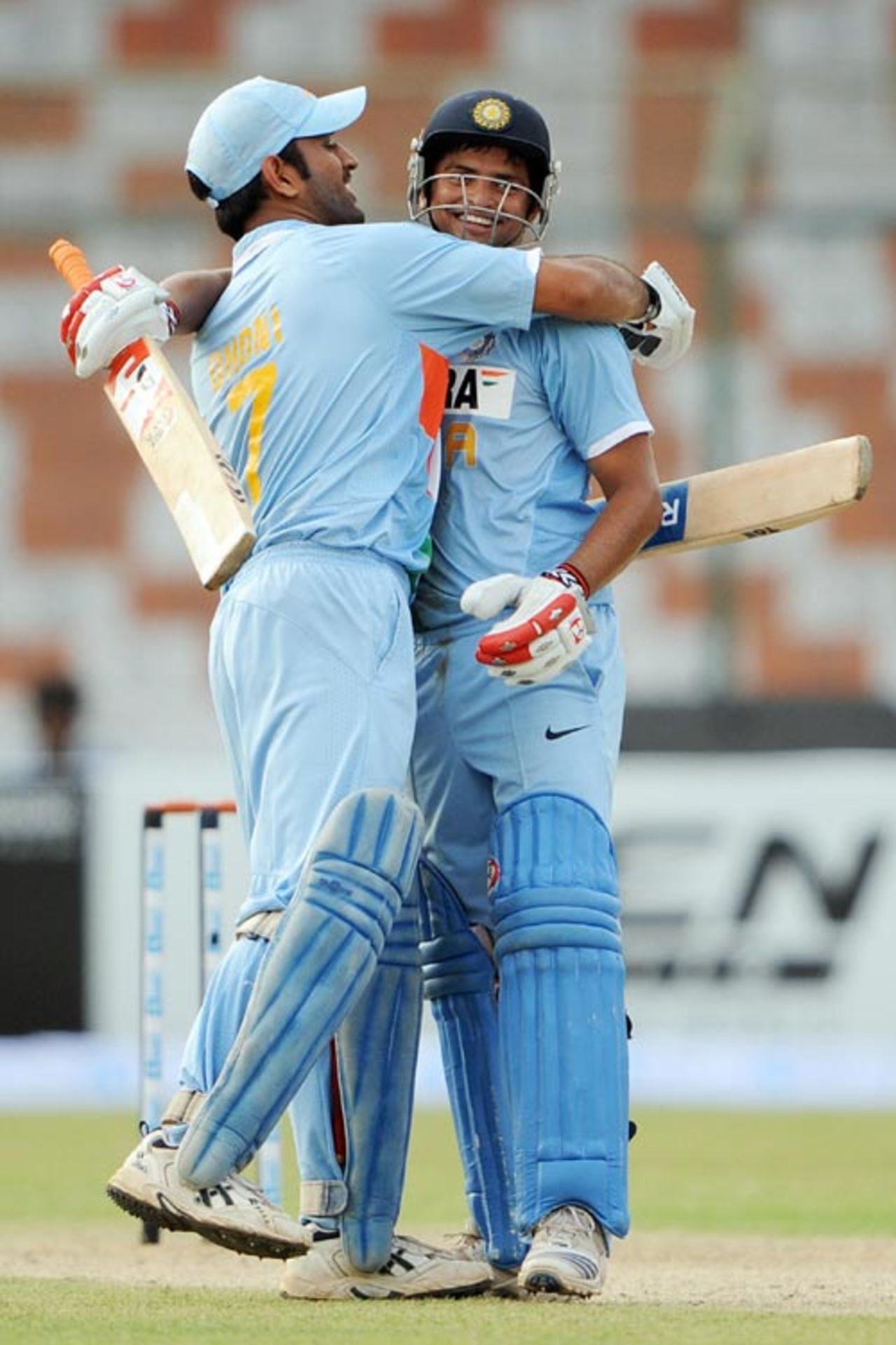 On reaching his century Suresh Raina gets a hug from captain Mahendra Singh Dhoni, Hong Kong v India, Group B, Asia Cup, Karachi, June 25, 2008