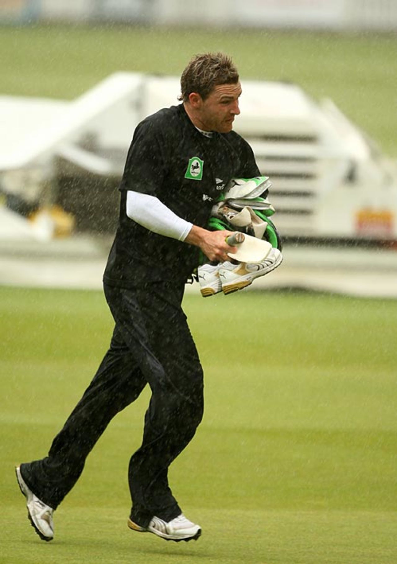 Brendon McCullum runs towards the dressing room in the rain, Lord's, June 27, 2008