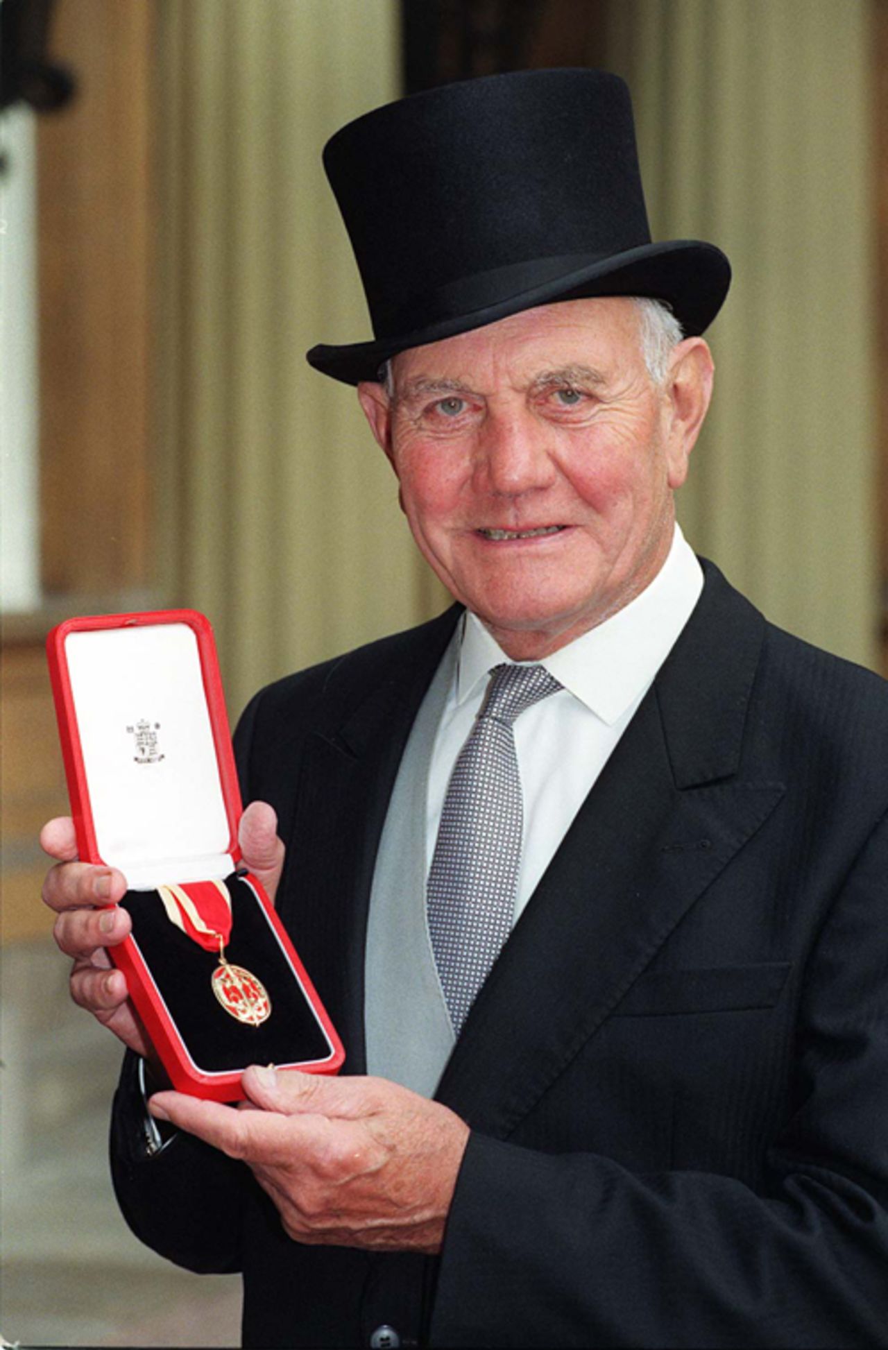Sir Alec Bedser is knighted at Buckingham Palace, March 18, 1997