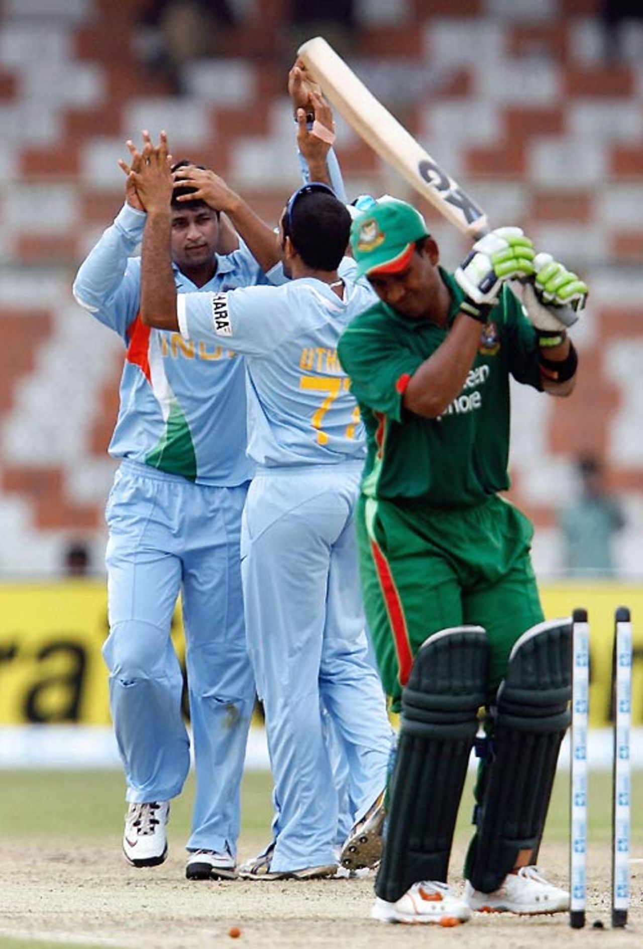 Pragyan Ojha sends back Raqibul Hasan to claim his first ODI wicket, Bangladesh v India, Super Four, Asia Cup, Karachi, June 28, 2008 