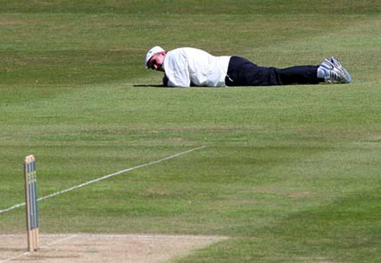 Hit the deck: George Sharp stays low to avoid a swarm at bees at Hove, Sussex v Lancashire, 2nd day, Hove, June 30, 2008