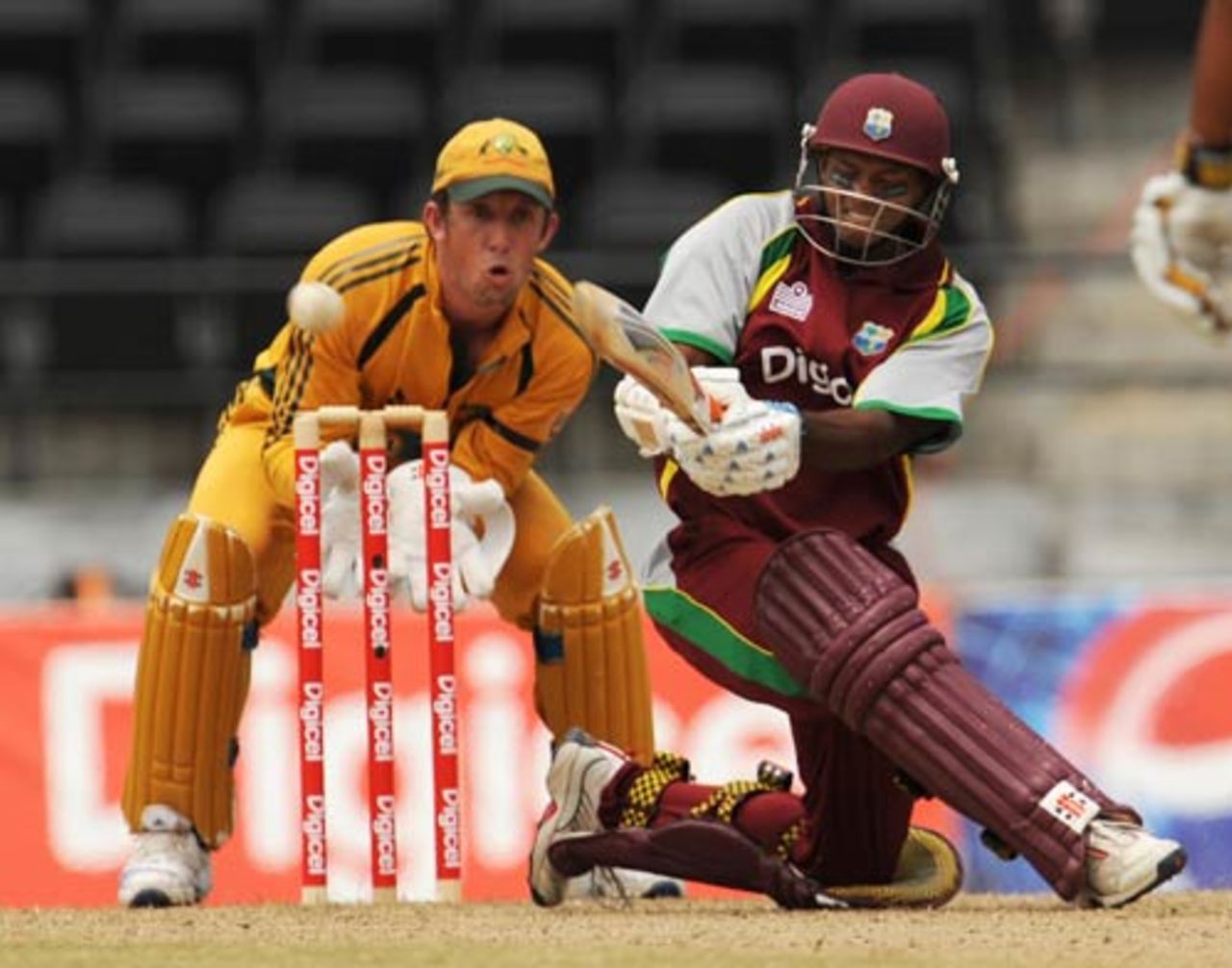 Shivnarine Chanderpaul sweeps as Luke Ronchi watches on, West Indies v Australia, 3rd ODI, Grenada, June 29, 2008