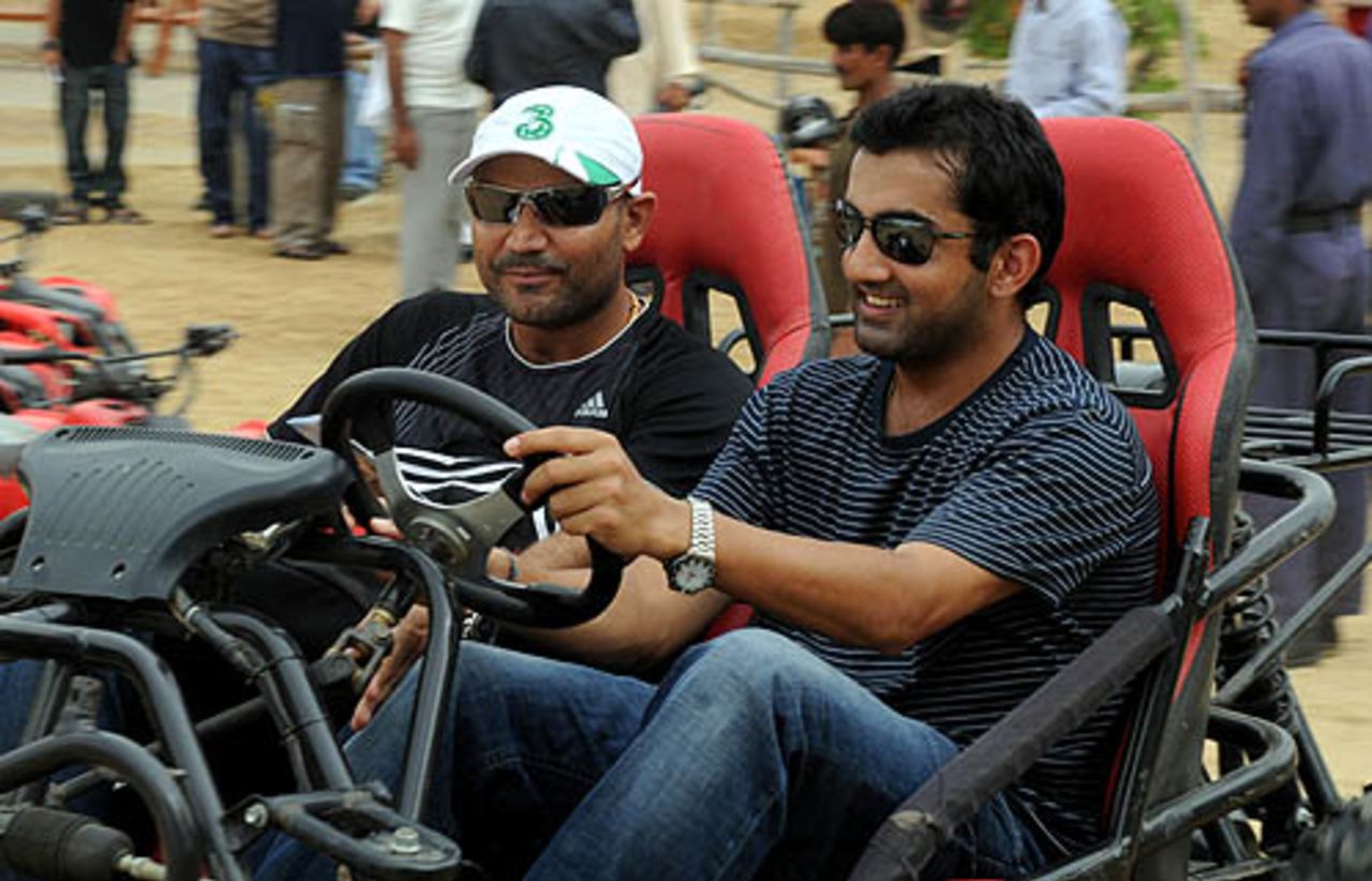 Virender Sehwag is driven around by Gautam Gambhir at a resort, Karachi, June 29, 2008