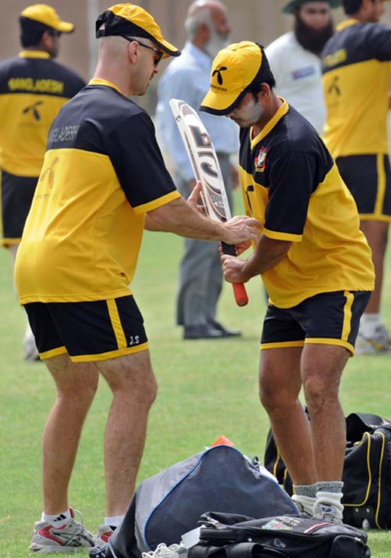Bangladesh coach Jamie Siddons gives Nazimuddin some batting tips during a practice session, Karachi, July 2, 2008