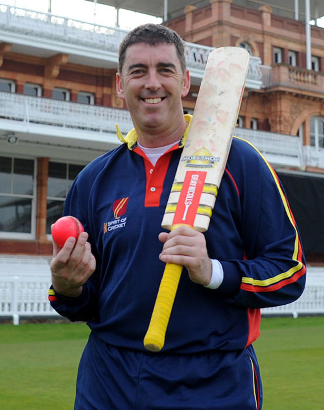 Darren Bicknell poses with the new MCC-pioneered pink ball, April 2008