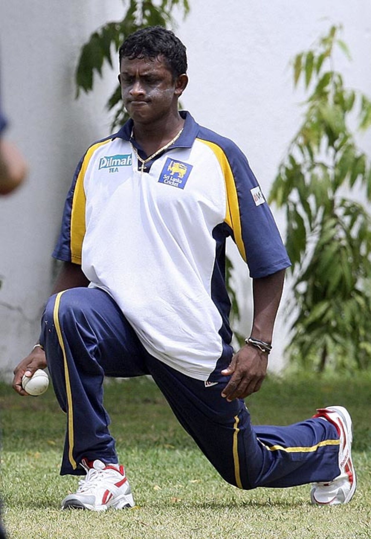Ajantha Mendis stretches during a training session on the eve of the Asia Cup final against India, Karachi, July 5, 2008