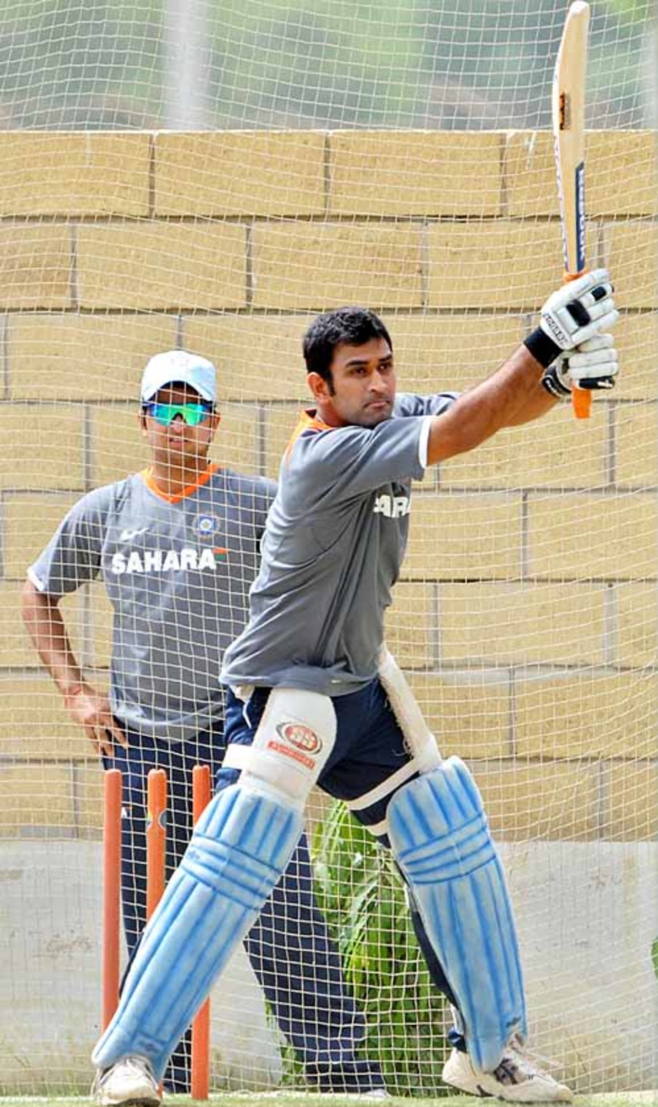 Mahendra Singh Dhoni has a hit in the nets as Suresh Raina looks on, Asia Cup, Karachi, July 5, 2008