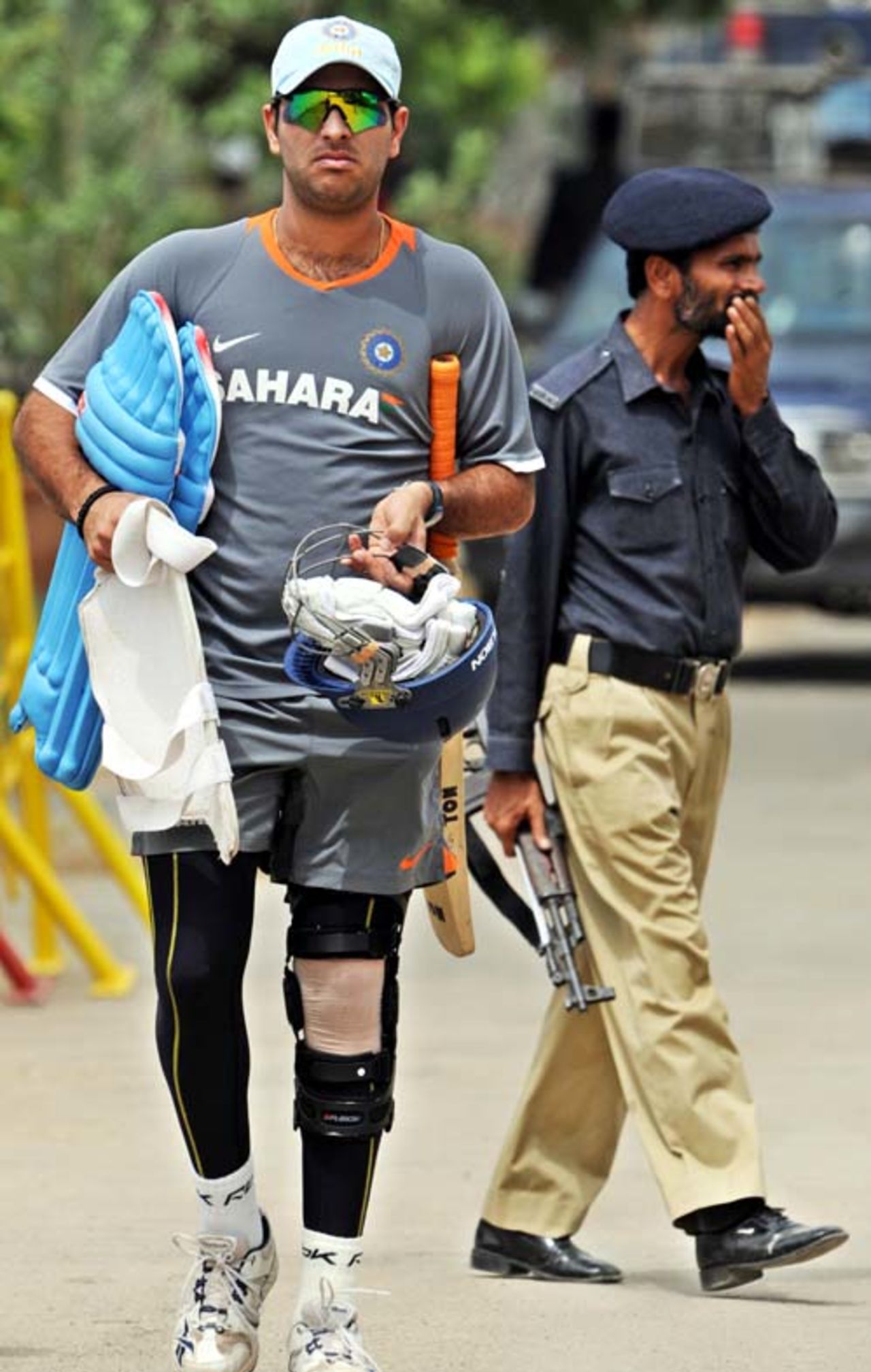 Yuvraj Singh walks in for practice along with his now common knee brace, Asia Cup, Karachi, July 5, 2008