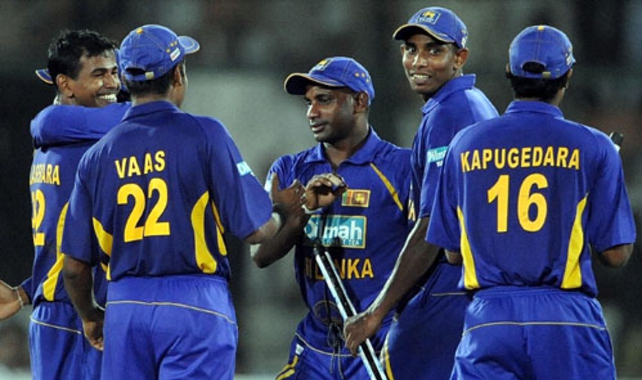 The Sri Lankan players pick up souvenirs after their win, India v Sri Lanka, Asia Cup final, Karachi, July 6, 2008