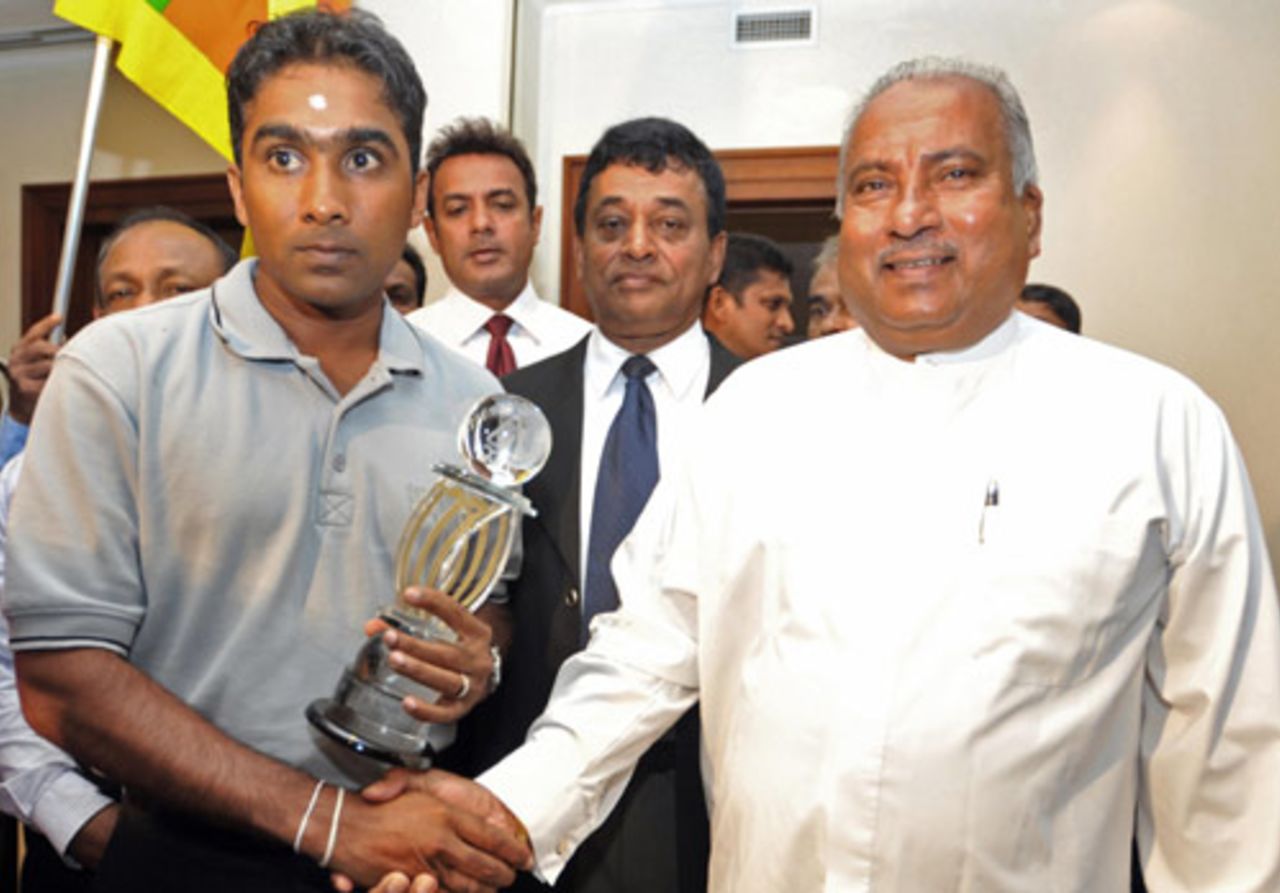 Mahela Jayawardene is greeted by Sri Lanka's sports minister after a successful Asia Cup campaign, Colombo, July 9, 2008