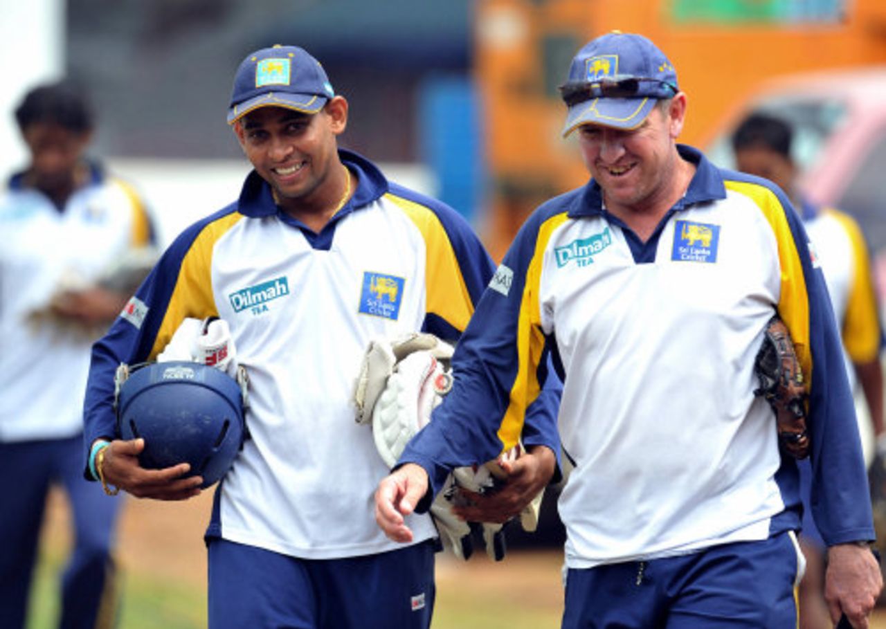 Tillakaratne Dilshan and Trevor Bayliss share a joke on their way to practice, Galle, July 29, 2008 