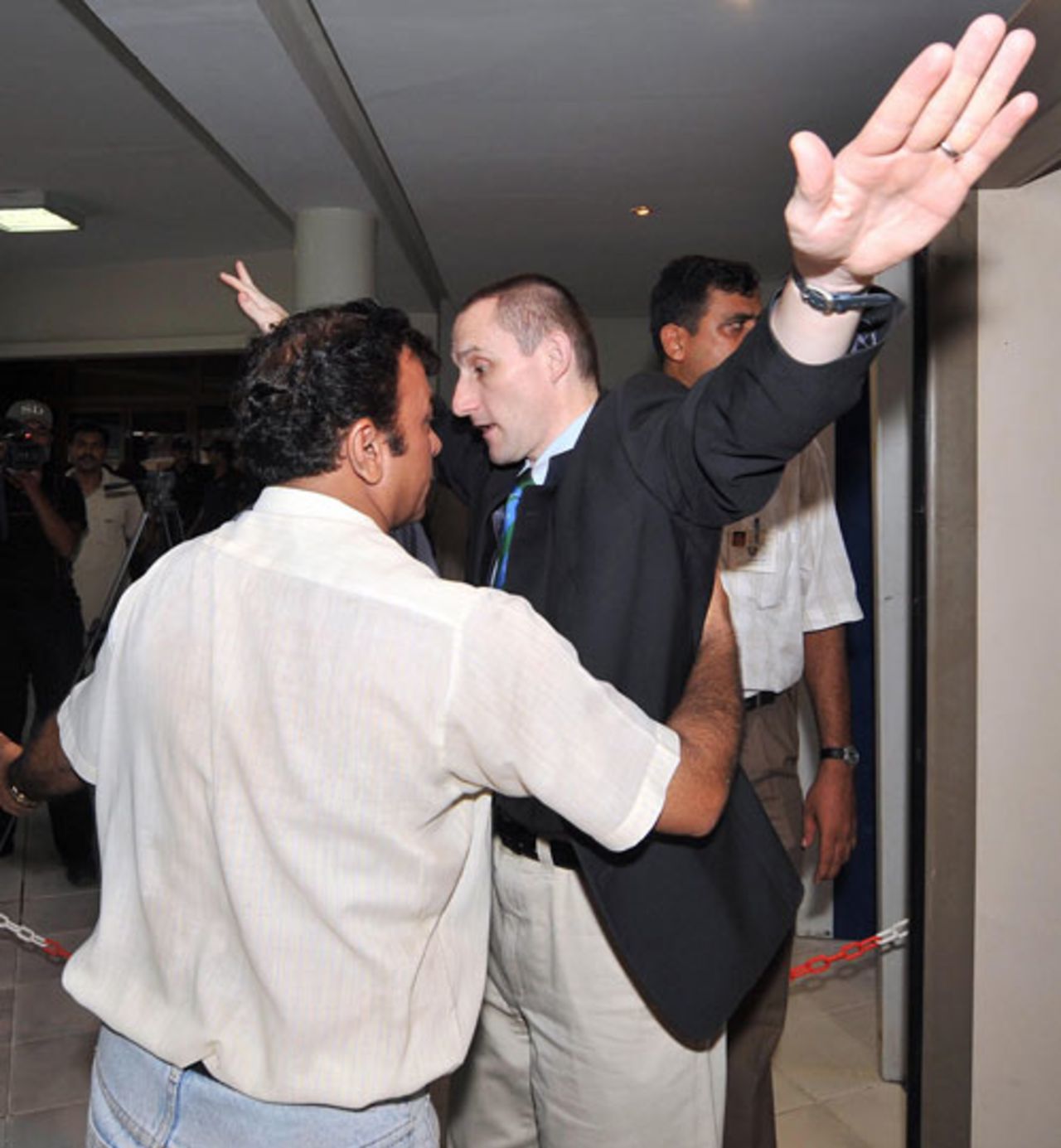 A security guard searches Brian Murgatroyd, one of six members of the ICC delegation in Pakistan ahead of the Champions Trophy, Lahore, August 11, 2008