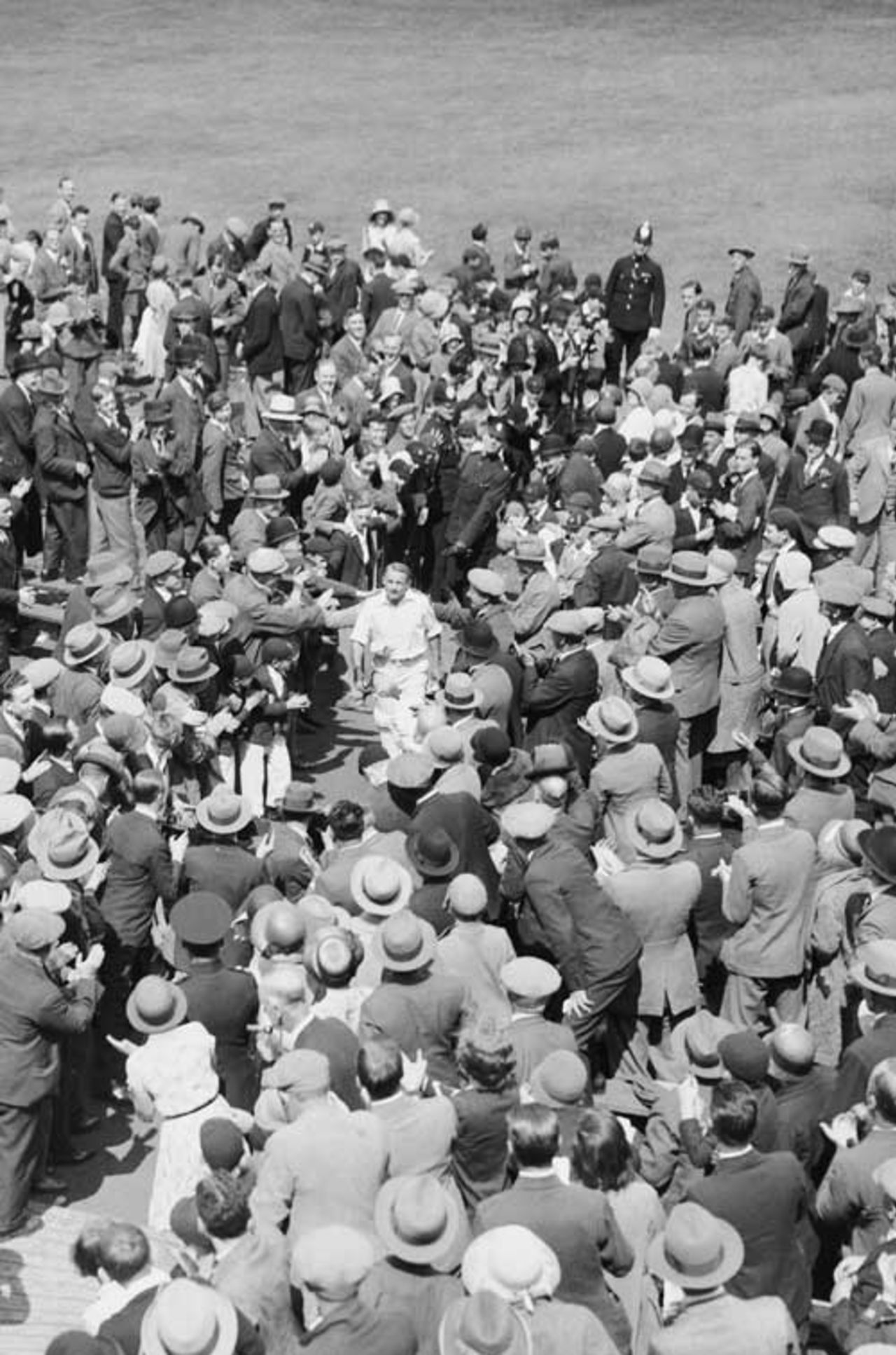 Fans surround Don Bradman as he returns to the pavilion after making a triple hundred, England v Australia, third Test, Headingley, 1930