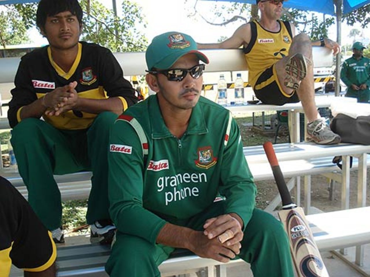 A disappointed Nazimuddin watches on after injuring his hand, Australian Institute of Sports v Bangladeshis, Darwin, August 18, 2008