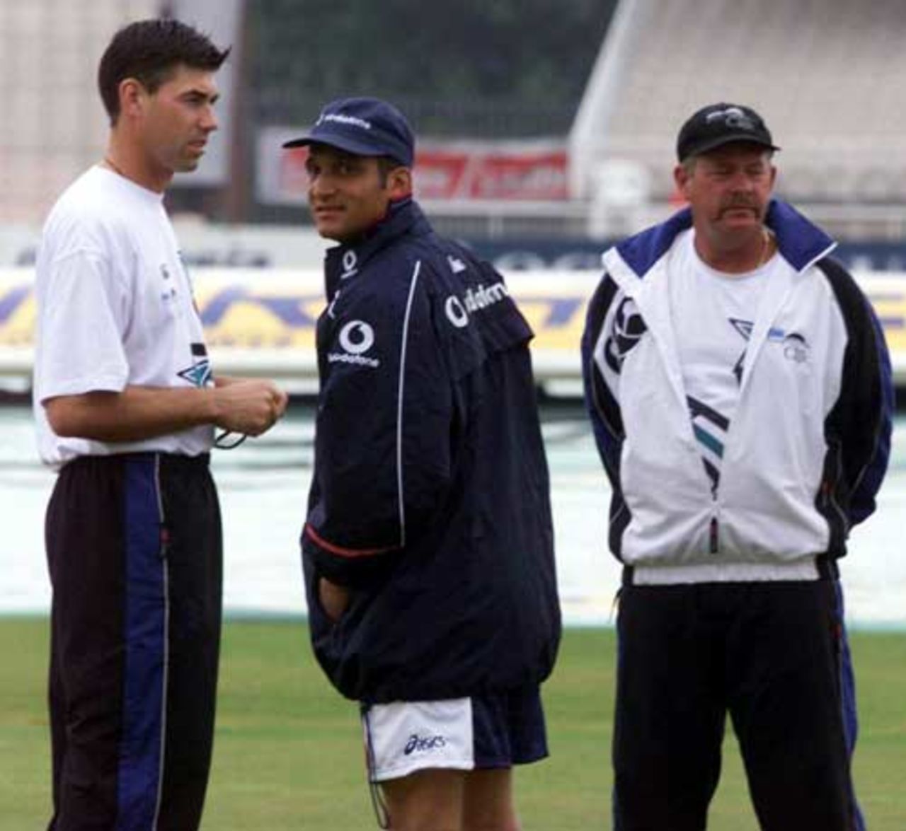 Stephen Fleming, Mark Butcher and Steve Rixon chat during a rain delay, England v New Zealand, 3rd Test, Old Trafford, 1999