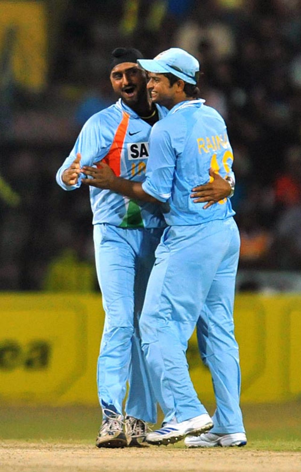 Suresh Raina hugs Harbhajan Singh after the fall of Chaminda Vaas' wicket, Sri Lanka v India, 3rd ODI, Premadasa Stadium, Colombo, August 24, 2008