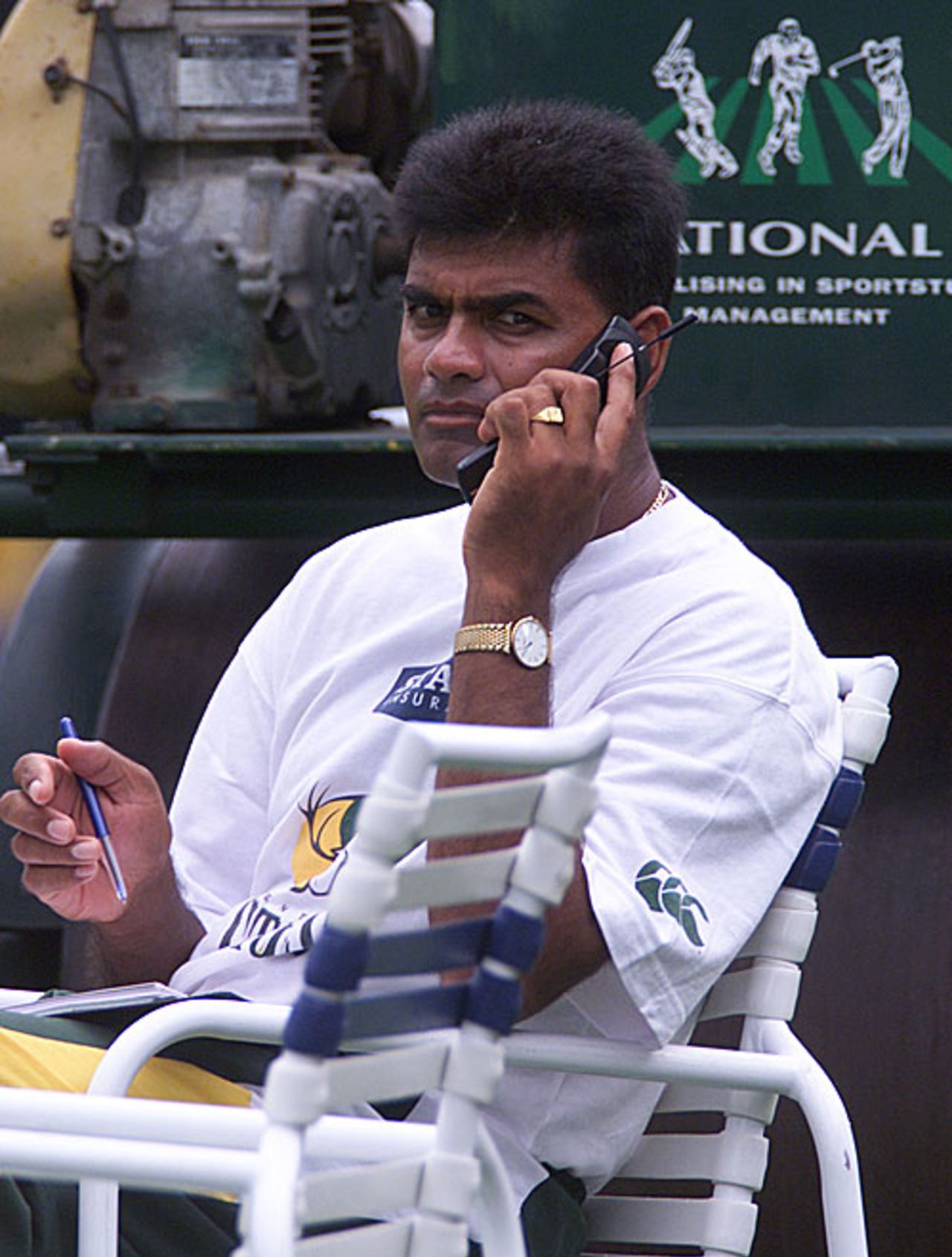 Central Districts coach Dipak Patel is busy on a call, Auckland, February 15, 2001