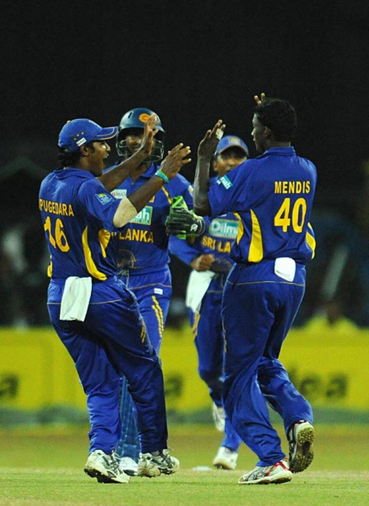 Sri Lankan players congratulate Ajantha Mendis on getting Zaheer Khan, Sri Lanka v India, 5th ODI, Colombo, August 29, 2008 
