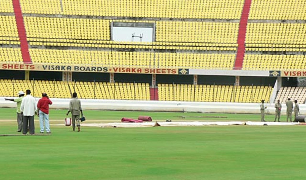 Groundsmen tend to the pitch and wet outfield, India A v Australia A, Hyderabad, September 10, 2008  
