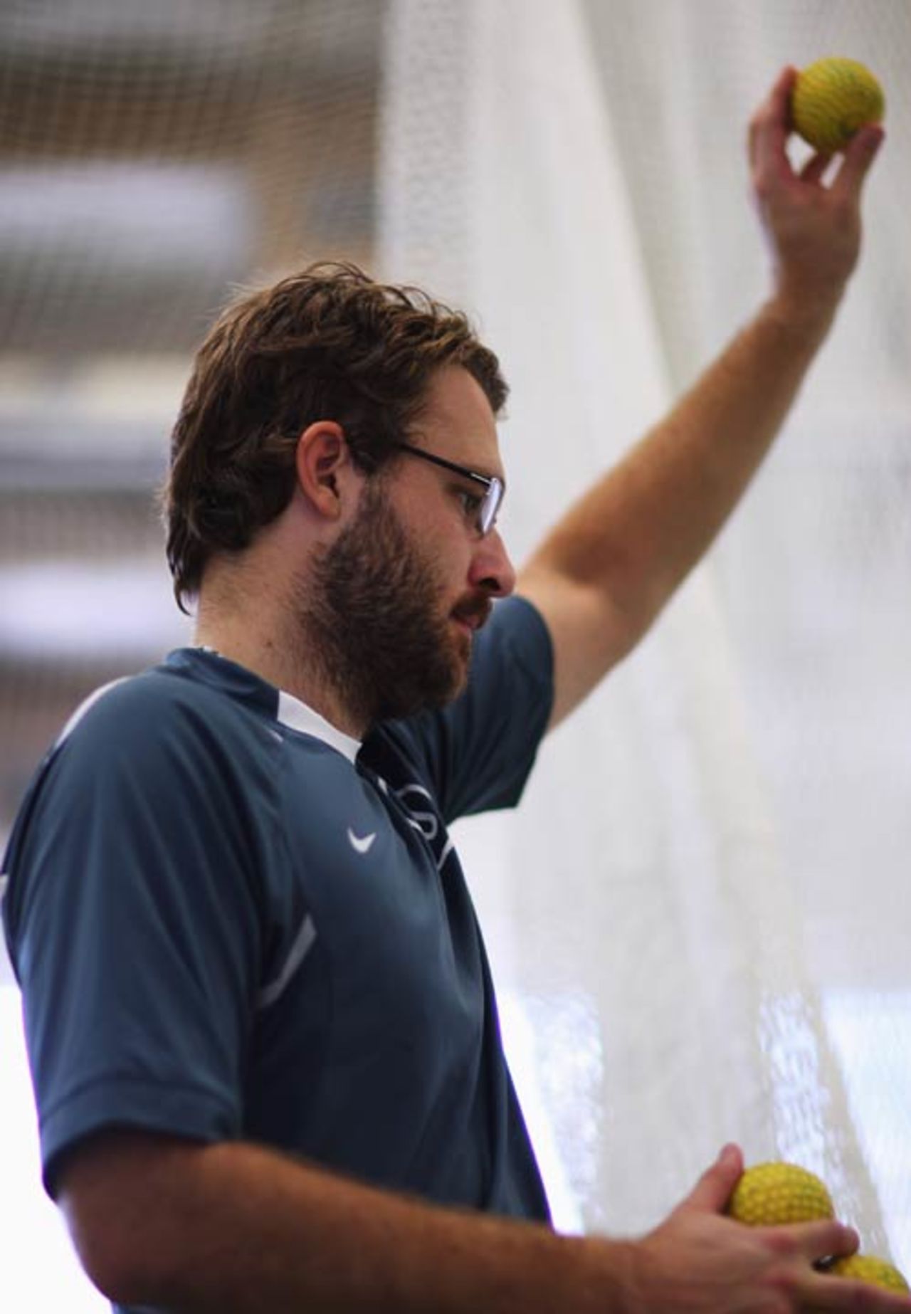 Daniel Vettori loads a ball into a bowling machine at a New Zealand training session, Auckland, September 24, 2008