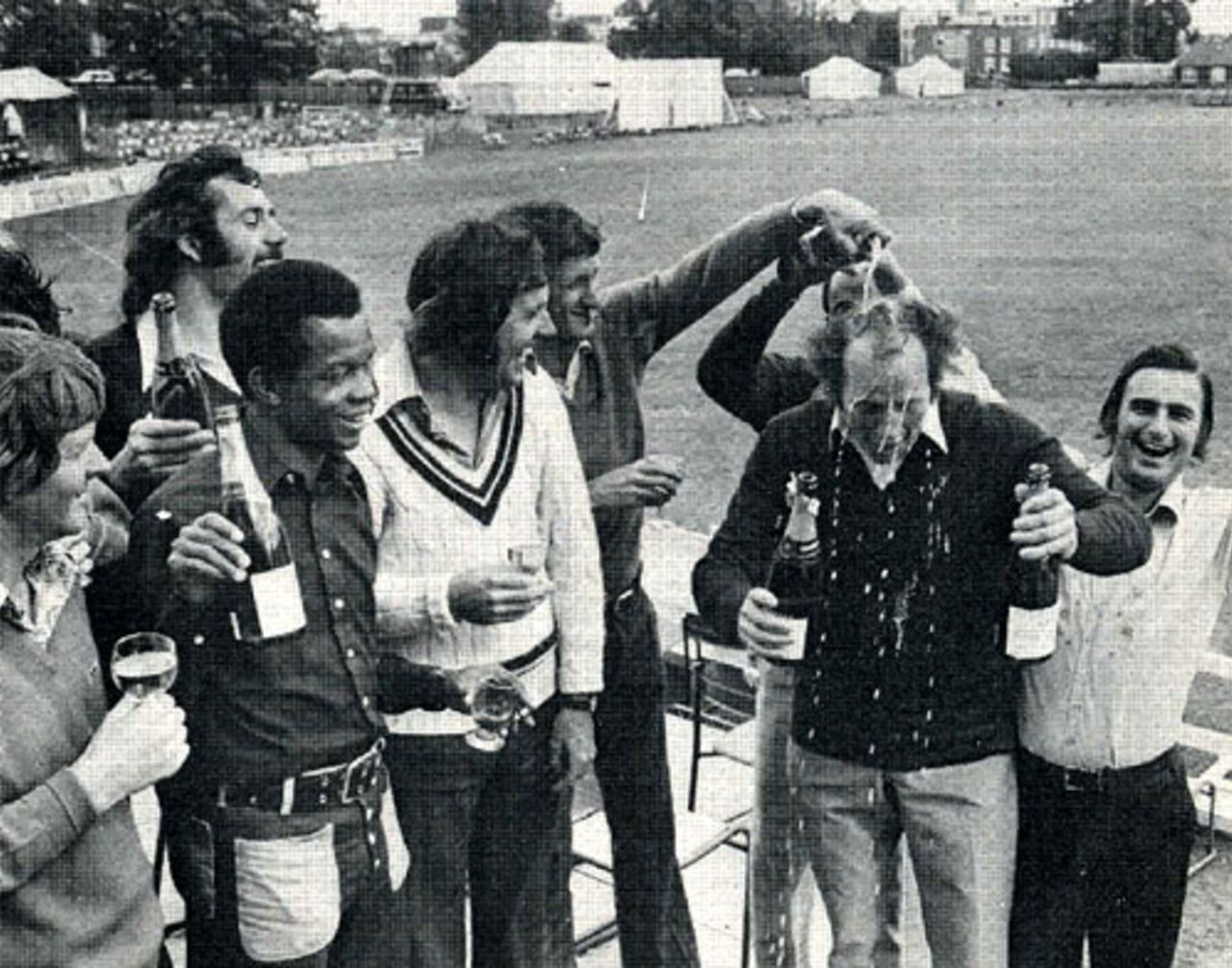 Norman Gifford gets a champagne shampoo after Worcestershire are confirmed as 1974 County Champions.  From left to right Glenn Turner, John Inchmore, Ron Headley, Jim Yardley, Brian Brain, Vanburn Holder (behind Gifford) and Alan Ormrod, Chelmsford, September 3, 1974