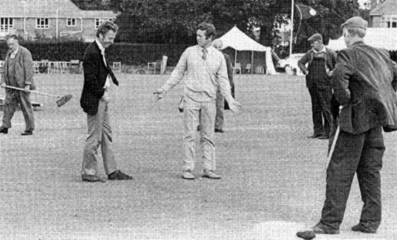 Richard Gilliatt gives a rueful smile as John Hampshire explains the state of the pitch as rain washed out the match, therefore robbing Hampshire (the county) of a chance of retaining their Championship crown, Bournemouth September 3, 1974