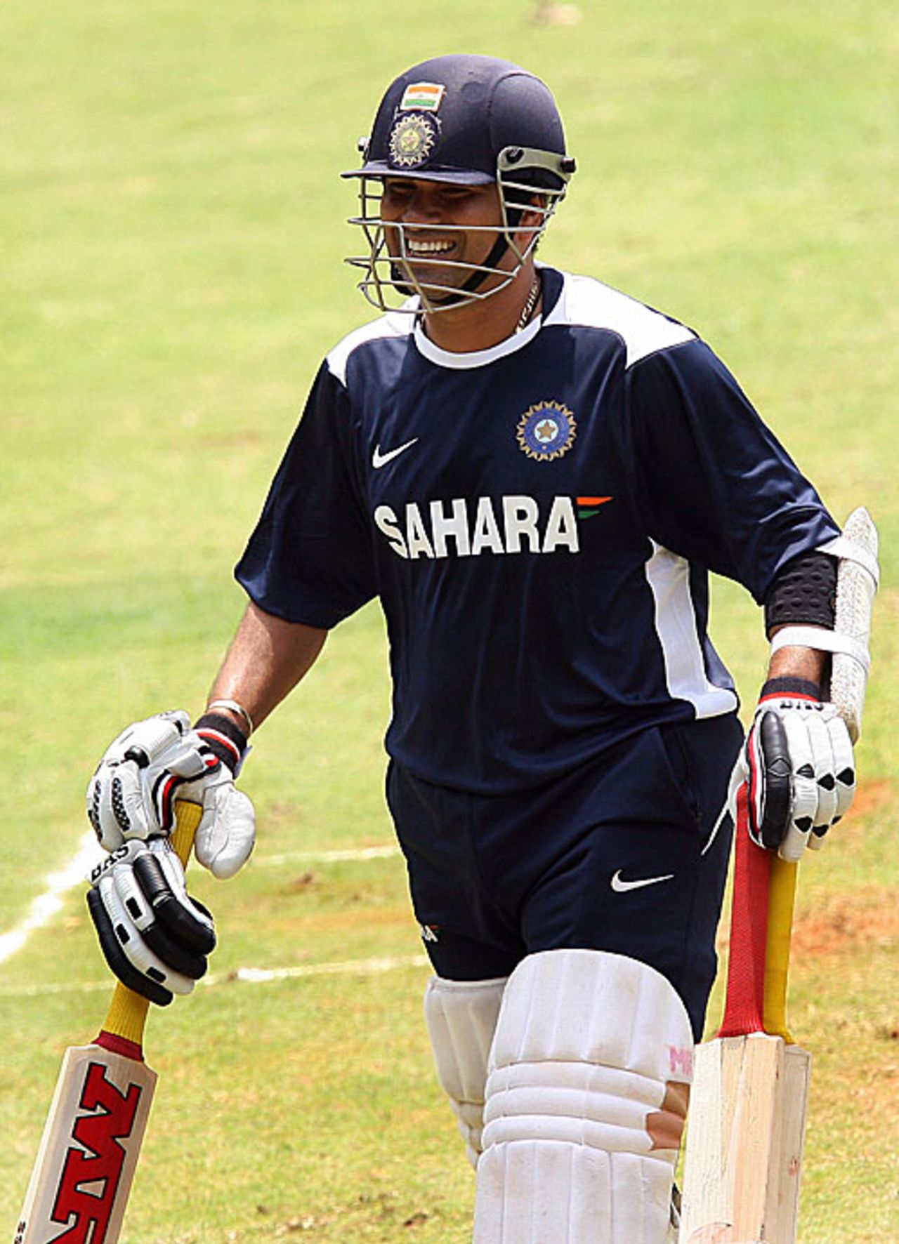 Sachin Tendulkar clutches three bats as he prepares for a nets session, Bangalore, September 30, 2008