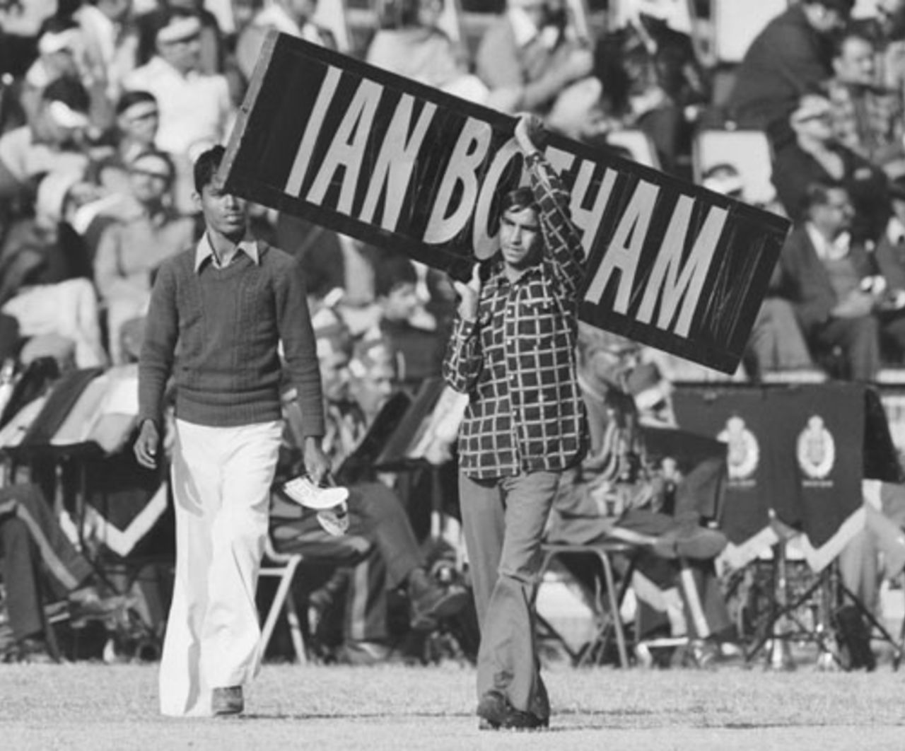 A fan carries a sign carrying Ian Botham name, Jammu, December 1, 1980