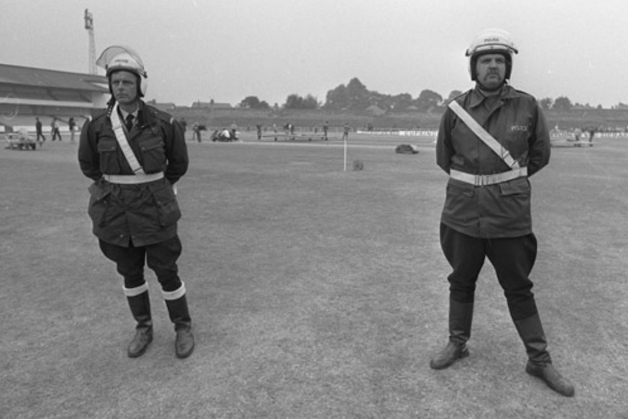 Policemen guard the Headingley pitch after vandals dug it up in support of George Davies, August 19, 1975