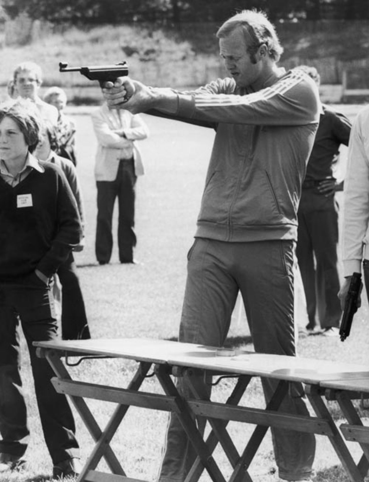 Tony Greig takes aim during the target-shooting event on the 'Superstars' television program, July 22, 1974
