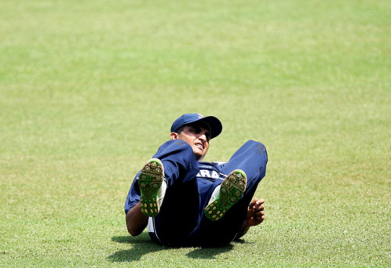 Sourav Ganguly hits the ground after missing a catch during practice, Bangalore, October 7, 2008