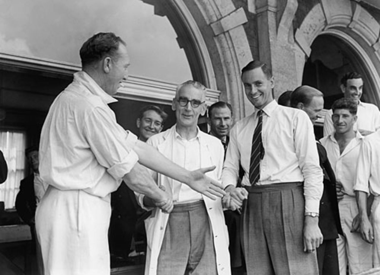 Surrey captain Stuart Surridge, vice-captain Peter May and masseuse Sandy Tait shake hands, August 26, 1955