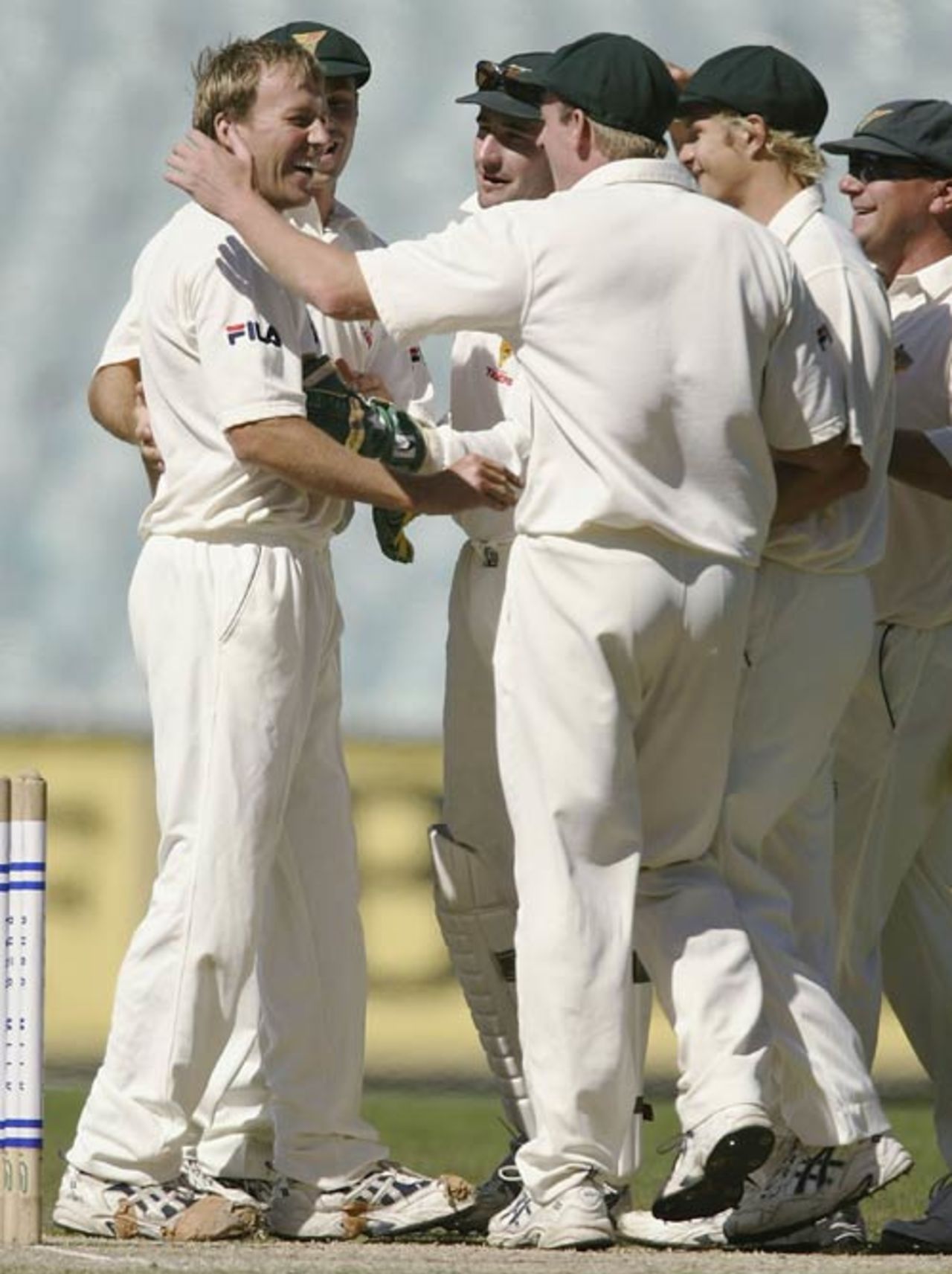 Gerard Denton's team-mates congratulate him on a wicket, Victoria v Tasmania, Pura Cup, Melbourne, February 18, 2004