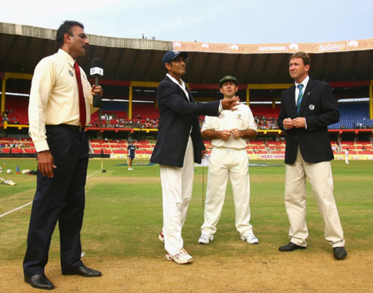 Commentator Ravi Shastri, Ricky Ponting and match referee Chris Broad watch Anil Kumble toss the coin, India v Australia, 1st Test, Bangalore, 1st day, October 9, 2008