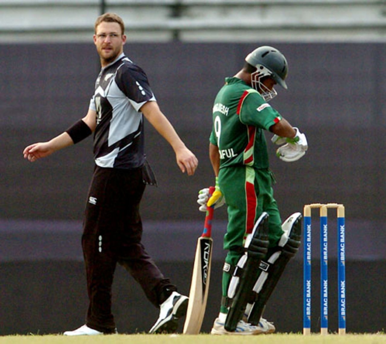 Daniel Vettori glances as Mohammad Ashraful reflects on a shot, Bangladesh v New Zealand, 1st ODI, Mirpur, October 9, 2008