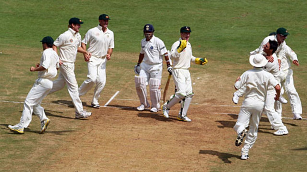 Team-mates congratulate Mitchell Johnson for dismissing Sachin Tendulkar, India v Australia, 1st Test, Bangalore, 3rd day, October 11, 2008