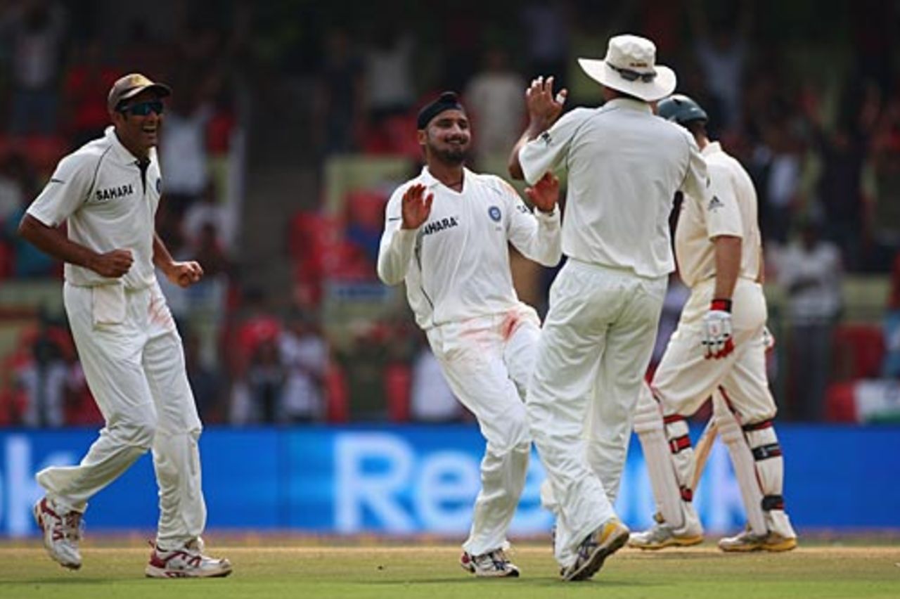 Team-mates rush to congratulate Harbhajan Singh after Simon Katich's dismissal, India v Australia, 1st Test, Bangalore, 4th day, October 12, 2008
