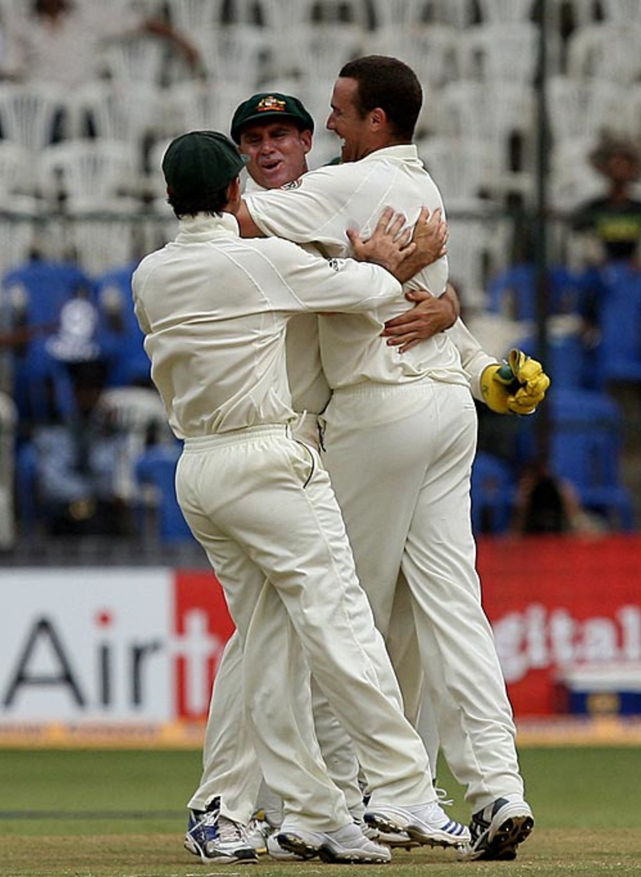 Stuart Clark is mobbed by team-mates after picking up Virender Sehwag's wicket, India v Australia, 1st Test, Bangalore, 5th day, October 13, 2008