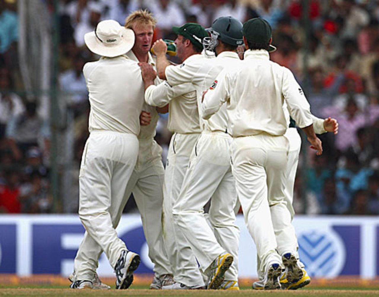 An emotional Cameron White is flanked by his team-mates after getting his debut wicket, India v Australia, 1st Test, Bangalore, 5th day, October 13, 2008