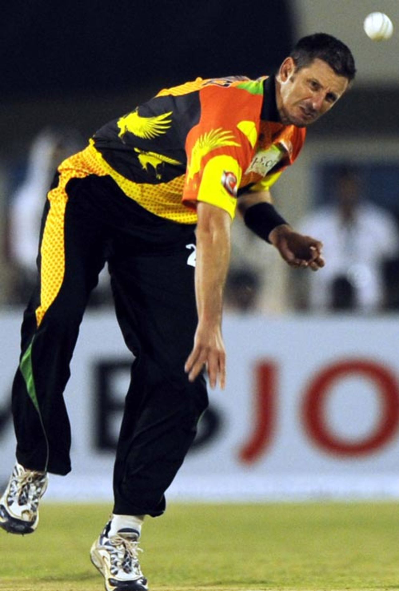 Michael Kasprowicz bends his back as he sends down a delivery, Chandigarh Lions v Mumbai Champs, Hyderabad, October 13, 2008 