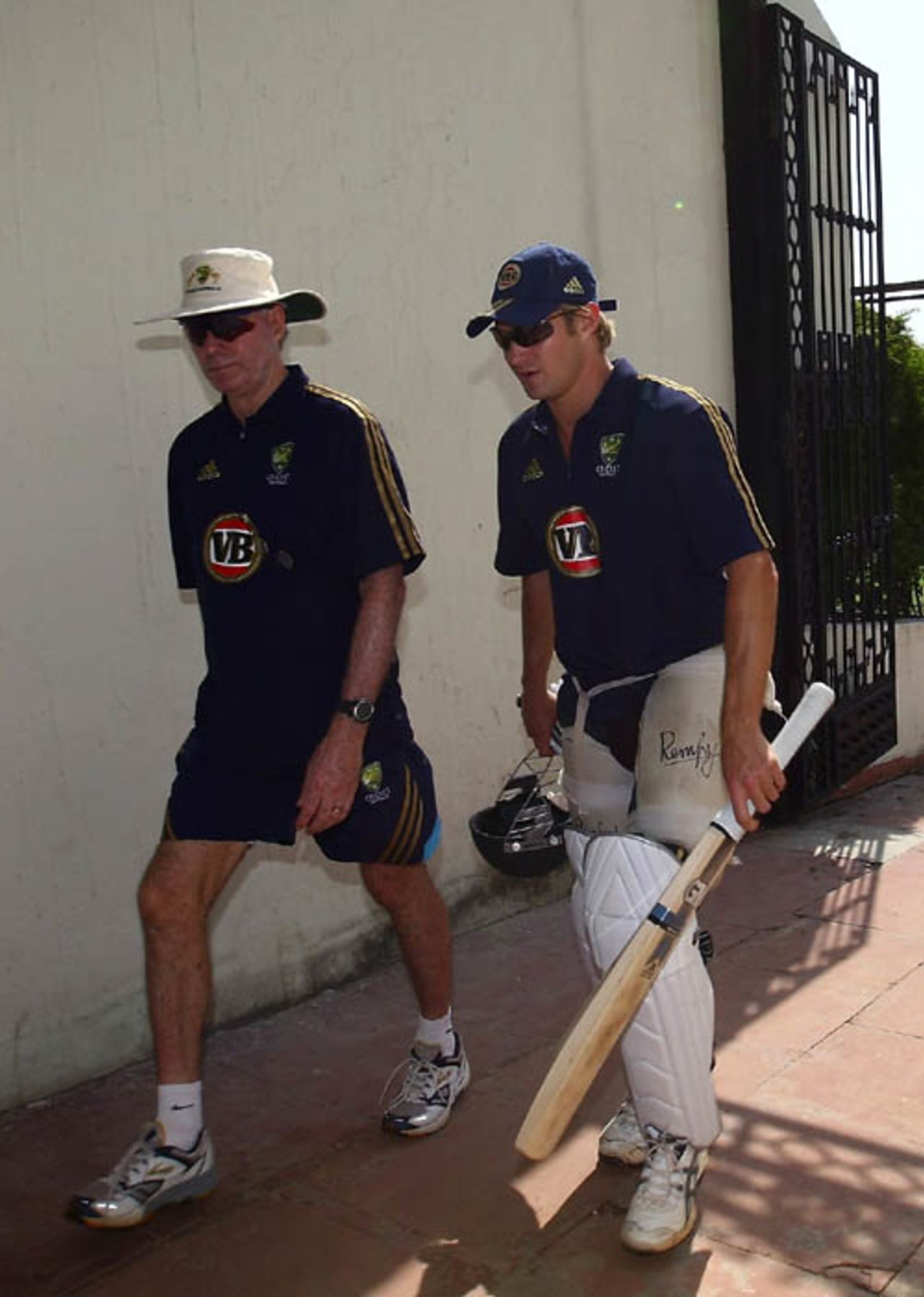 Greg Chappell and Shane Watson exit the ground after practice, Mohali, October 15, 2008