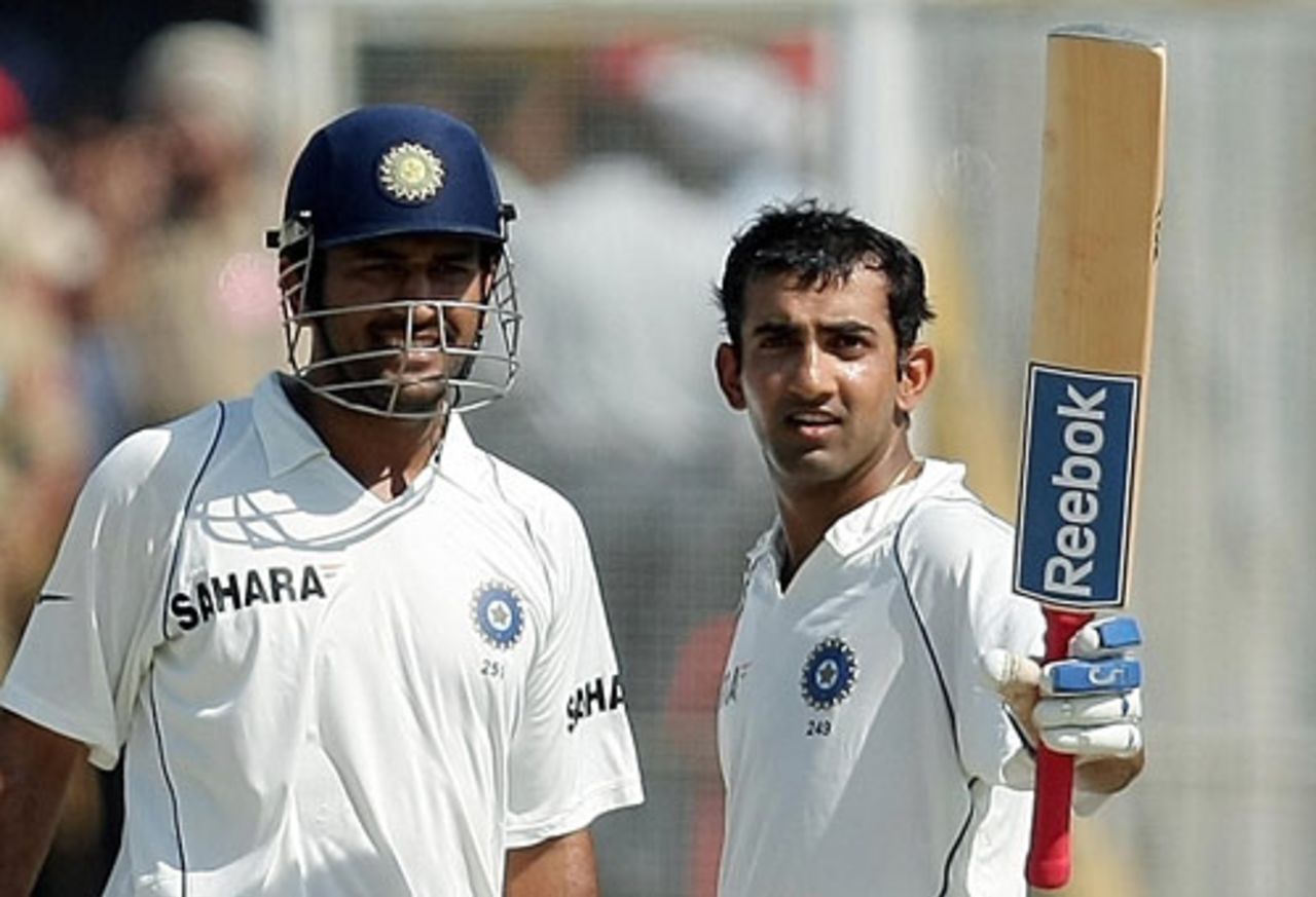 Mahendra Singh Dhoni is all smiles as Gautam Gambhir raises his bat after reaching his century, India v Australia, 2nd Test, Mohali, 4th day, October 20, 2008