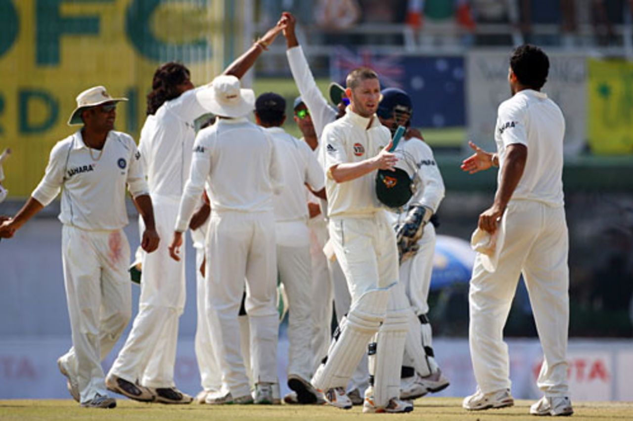 Michael Clarke greets Zaheer Khan as the Indian team celebrates in the background, India v Australia, 2nd Test, Mohali, 5th day, October 21, 2008
